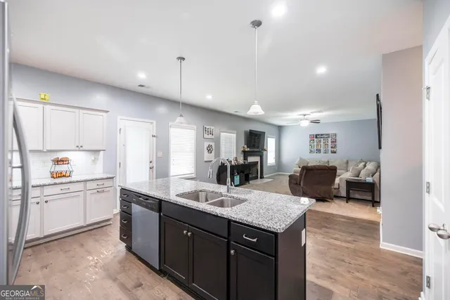a kitchen with counter top space cabinets and appliances