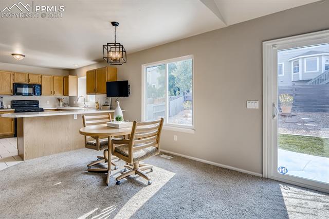 7390 Julynn Road Colorado Springs, CO 80919 - Photo 14 of 35 Dining area opens to kitchen!
