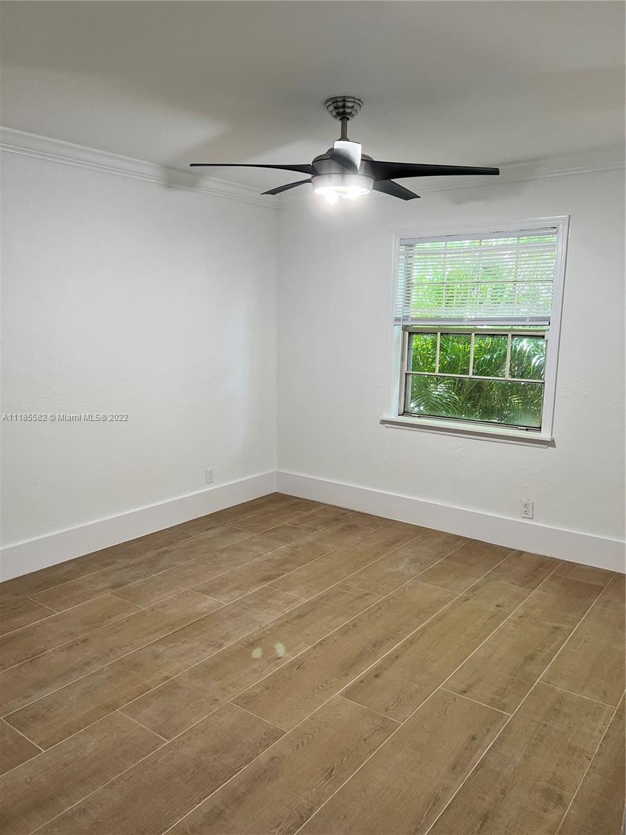 11156 Goss Lane Boca Raton, FL 33428 - Photo 18 of 20 an empty room with a empty space and windows