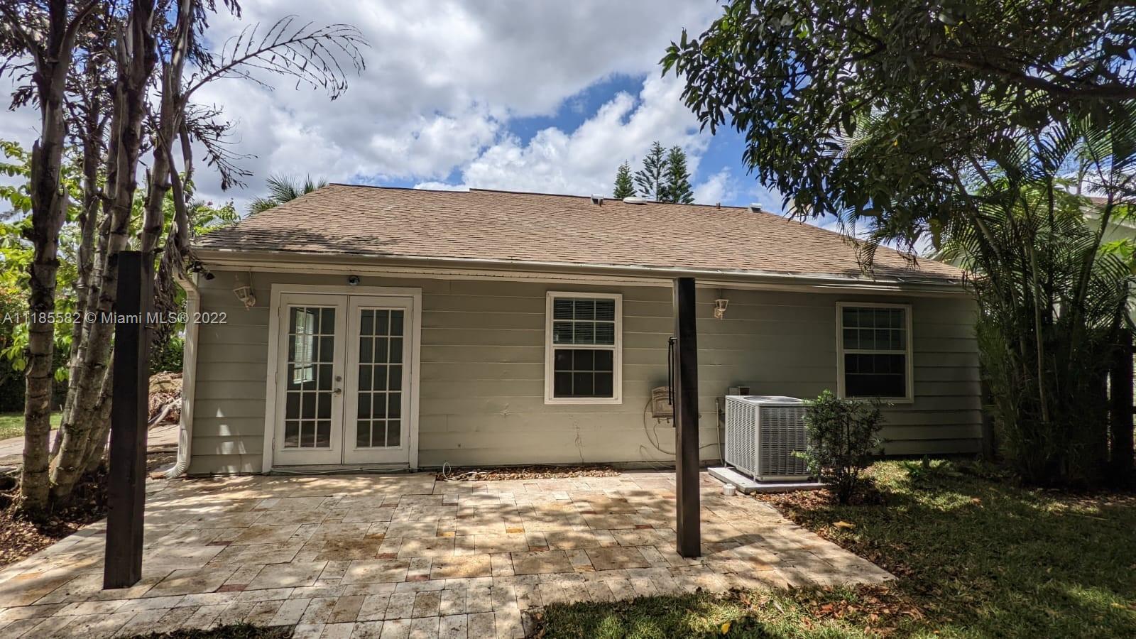 11156 Goss Lane Boca Raton, FL 33428 - Photo 20 of 20 a front view of a house with garden