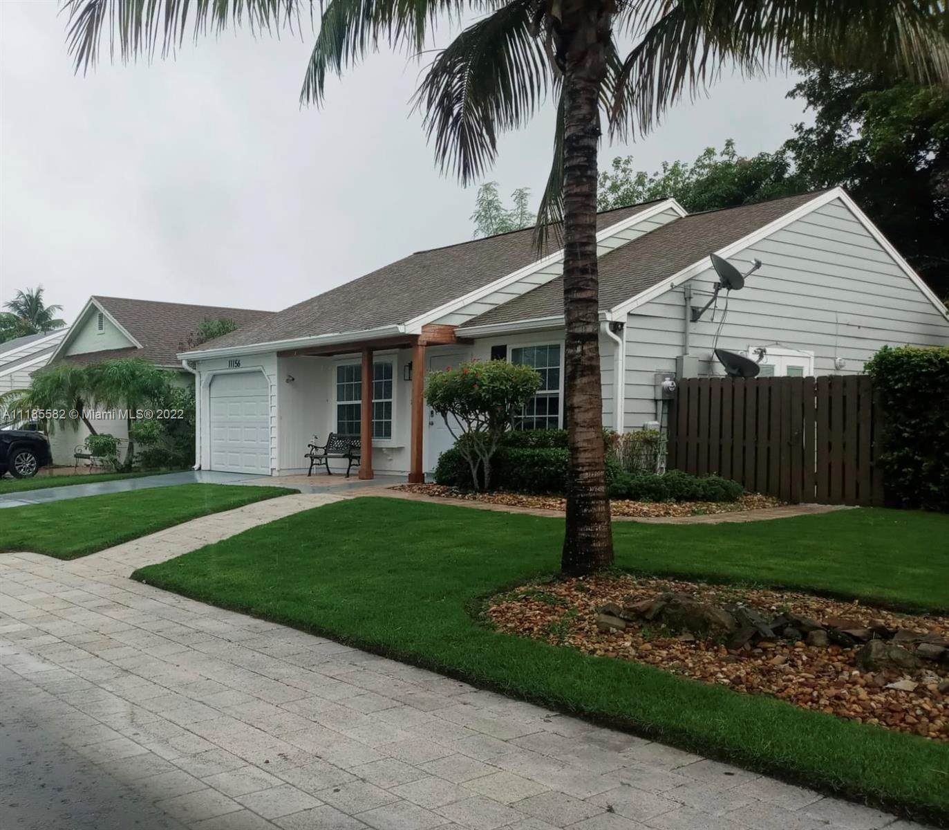 11156 Goss Lane Boca Raton, FL 33428 - Photo 2 of 20 a front view of house with a garden