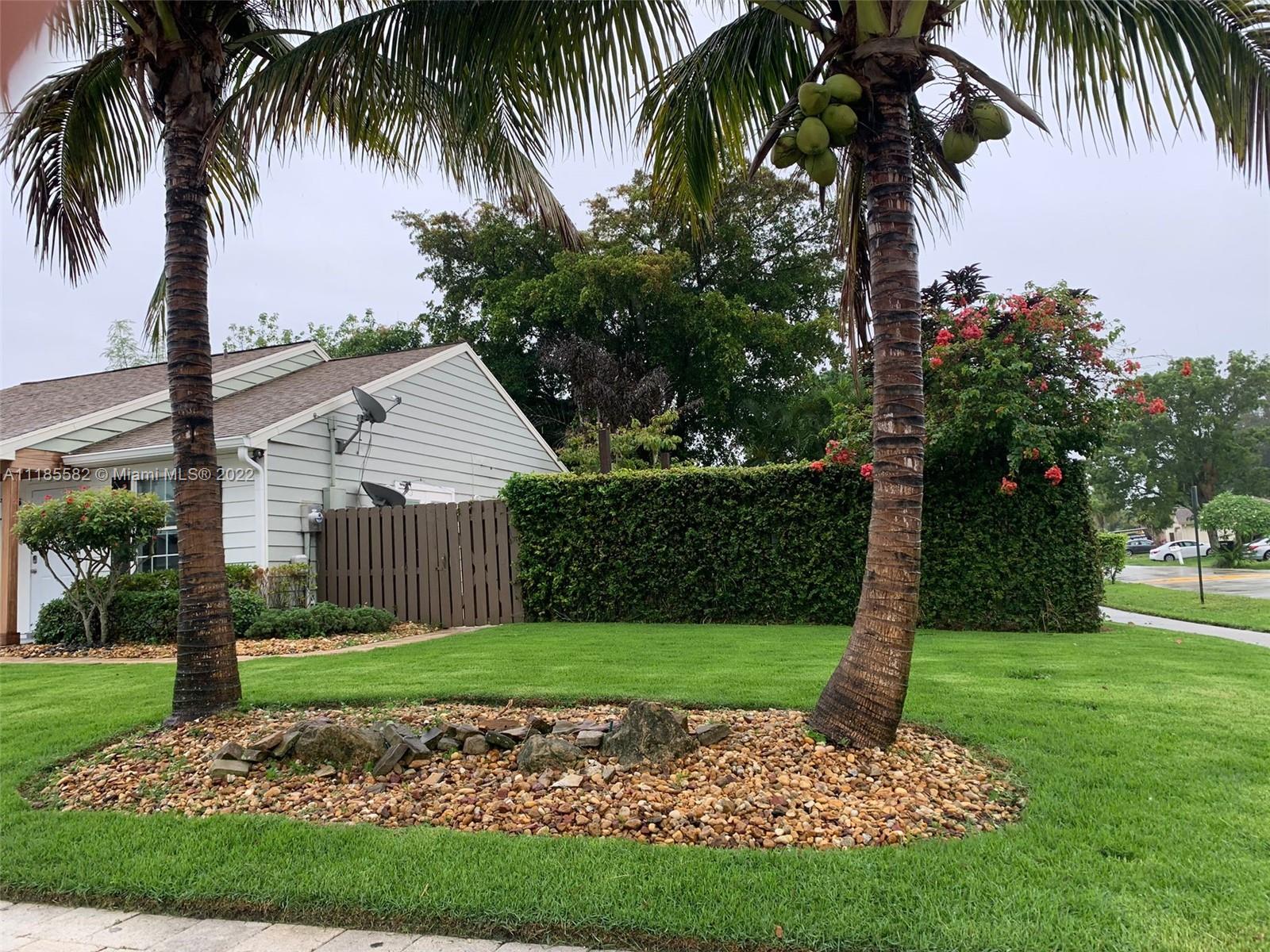 11156 Goss Lane Boca Raton, FL 33428 - Photo 3 of 20 a front view of a house with garden