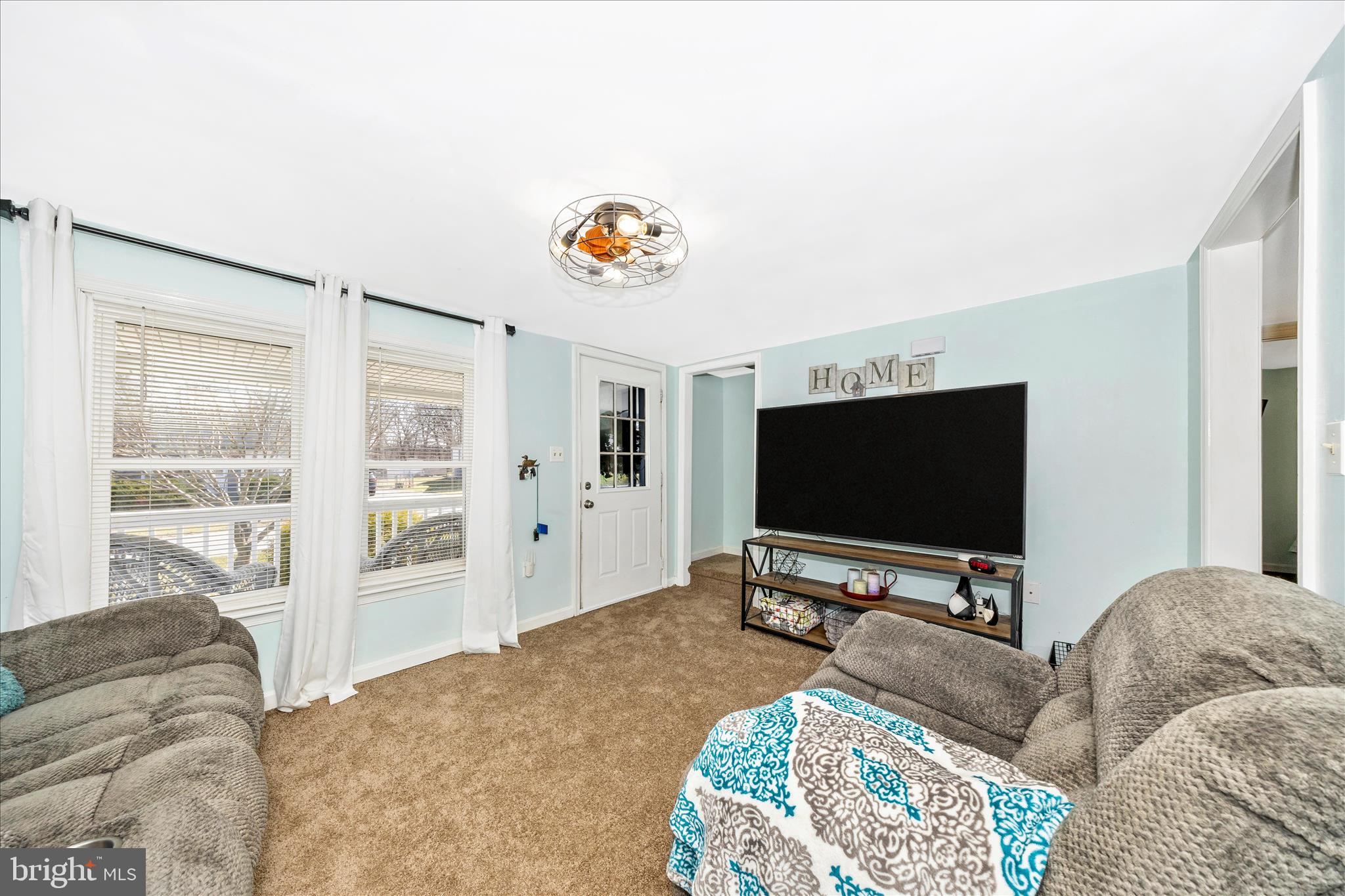 5618 Bartonsville Road Frederick, MD 21704 - Photo 5 of 53 a living room with furniture and a flat screen tv