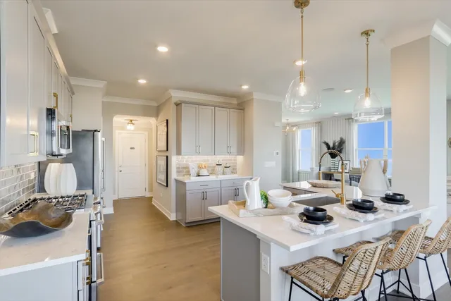 a kitchen with a refrigerator a sink and a stove