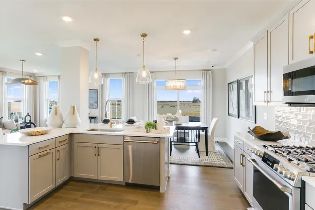 a kitchen with a sink stove and wooden cabinets