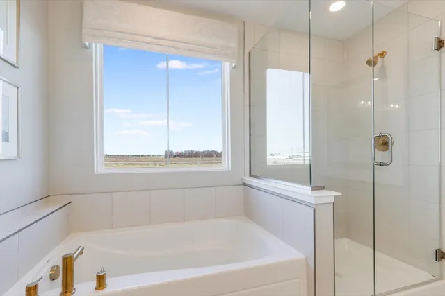 a white bath tub sitting next to a window