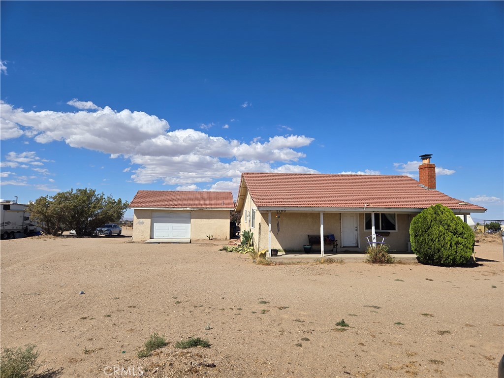 9760 Phelan Road Oak Hills, CA 92344 - Photo 3 of 8 a view of a house with a yard