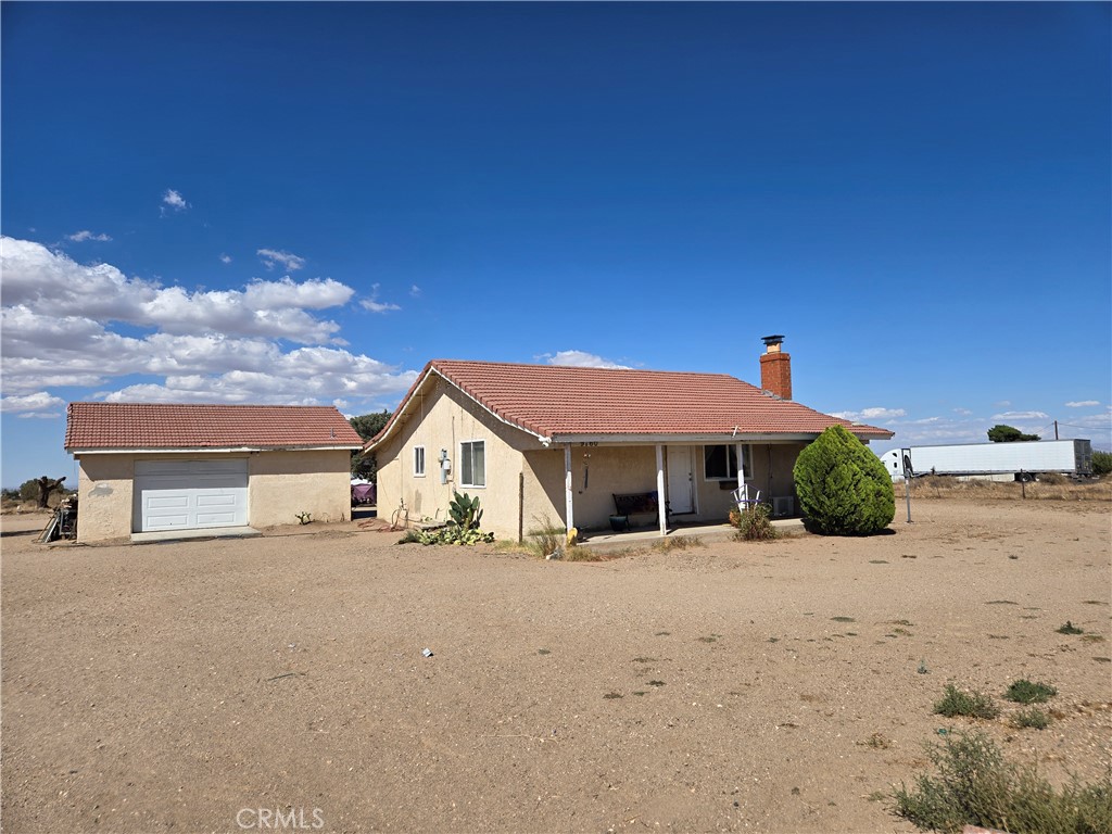 9760 Phelan Road Oak Hills, CA 92344 - Photo 4 of 8 a view of a house with a snow in the background