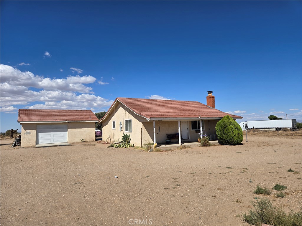 9760 Phelan Road Oak Hills, CA 92344 - Photo 4 of 8 a view of a house with a snow in the background
