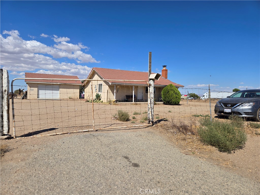 9760 Phelan Road Oak Hills, CA 92344 - Photo 6 of 8 a front view of a house with a yard