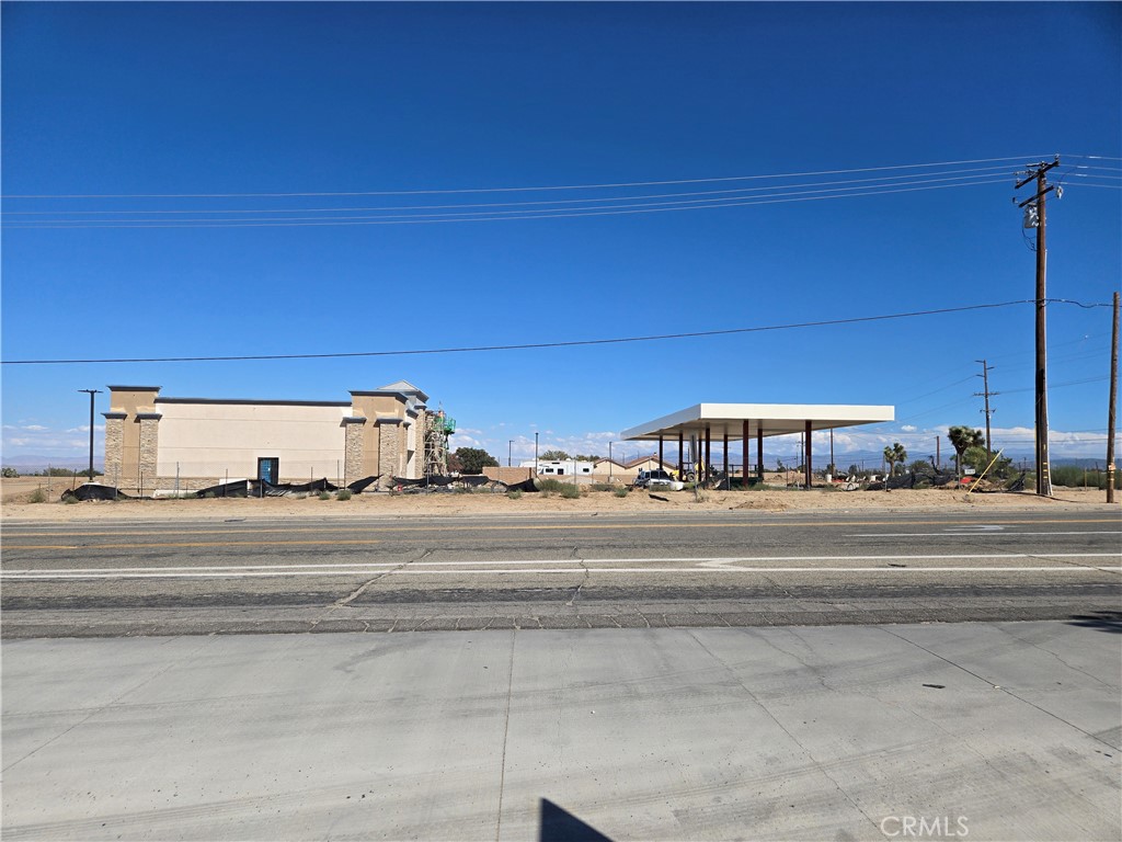 9760 Phelan Road Oak Hills, CA 92344 - Photo 8 of 8 a view of a building with a car parked car
