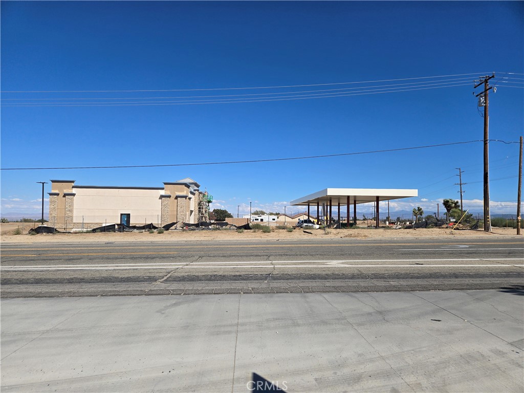 9760 Phelan Road Oak Hills, CA 92344 - Photo 8 of 8 a view of a building with a car parked car