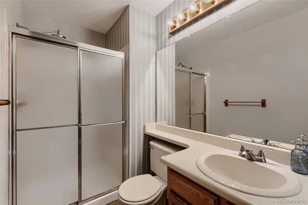 a bathroom with a sink double vanity and a mirror