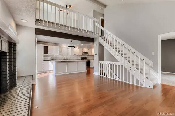 a view of kitchen with furniture and wooden floor