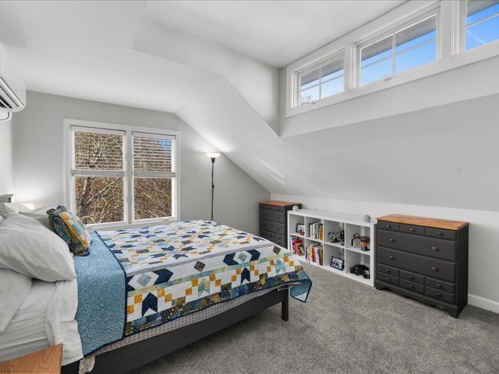 4 Strathmore Shire Drive, Unit B Uxbridge, MA 01569 - Photo 23 of 41 a bedroom with a bed closet and window