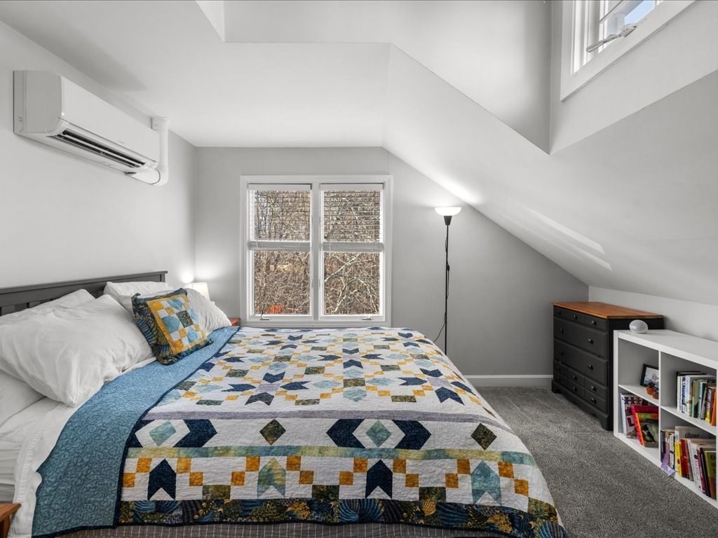 4 Strathmore Shire Drive, Unit B Uxbridge, MA 01569 - Photo 24 of 41 a bedroom with a bed and a window