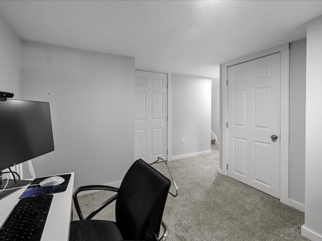 4 Strathmore Shire Drive, Unit B Uxbridge, MA 01569 - Photo 33 of 41 a view of a workspace with furniture and a flat screen tv