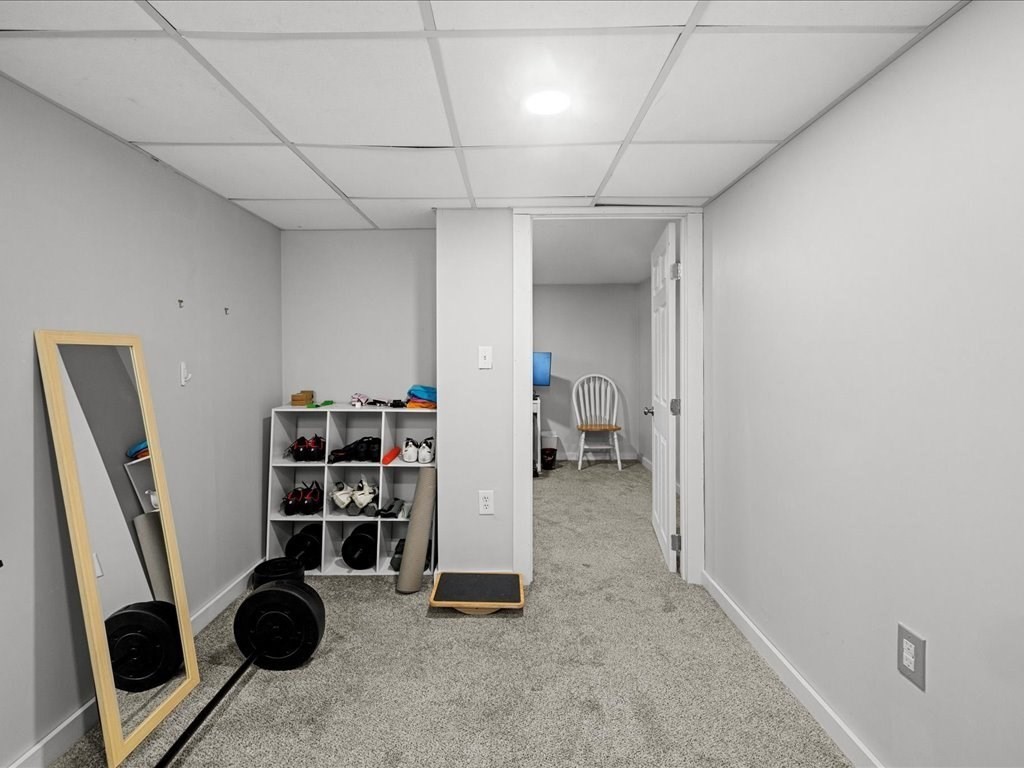 4 Strathmore Shire Drive, Unit B Uxbridge, MA 01569 - Photo 35 of 41 a view of walk in closet with clothes and shoes