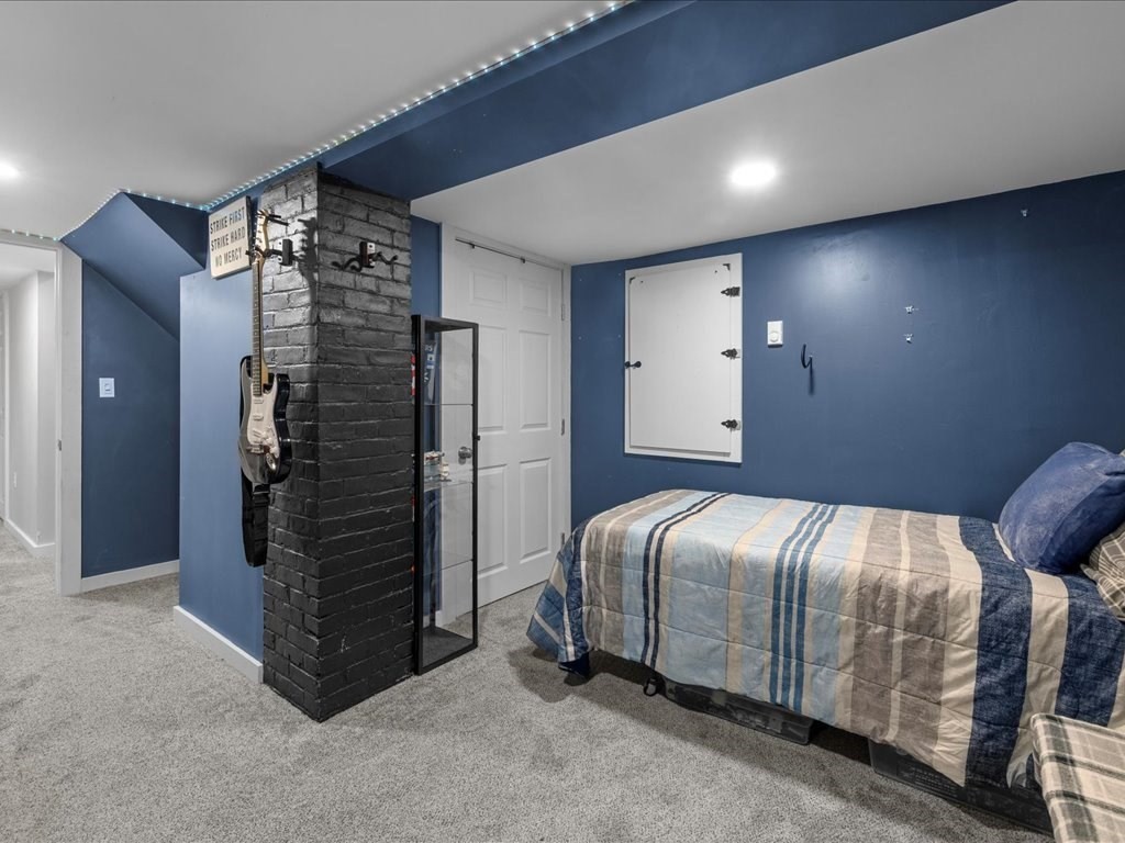 4 Strathmore Shire Drive, Unit B Uxbridge, MA 01569 - Photo 37 of 41 a bedroom with a bed and a walk in closet