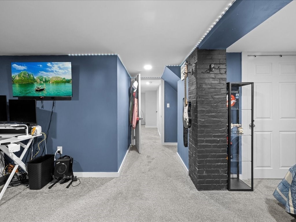4 Strathmore Shire Drive, Unit B Uxbridge, MA 01569 - Photo 39 of 41 a view of a livingroom with storage and utility