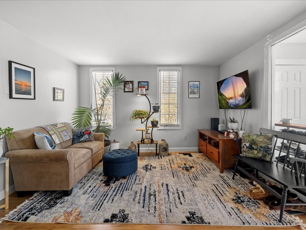 4 Strathmore Shire Drive, Unit B Uxbridge, MA 01569 - Photo 7 of 41 a living room with furniture and a window