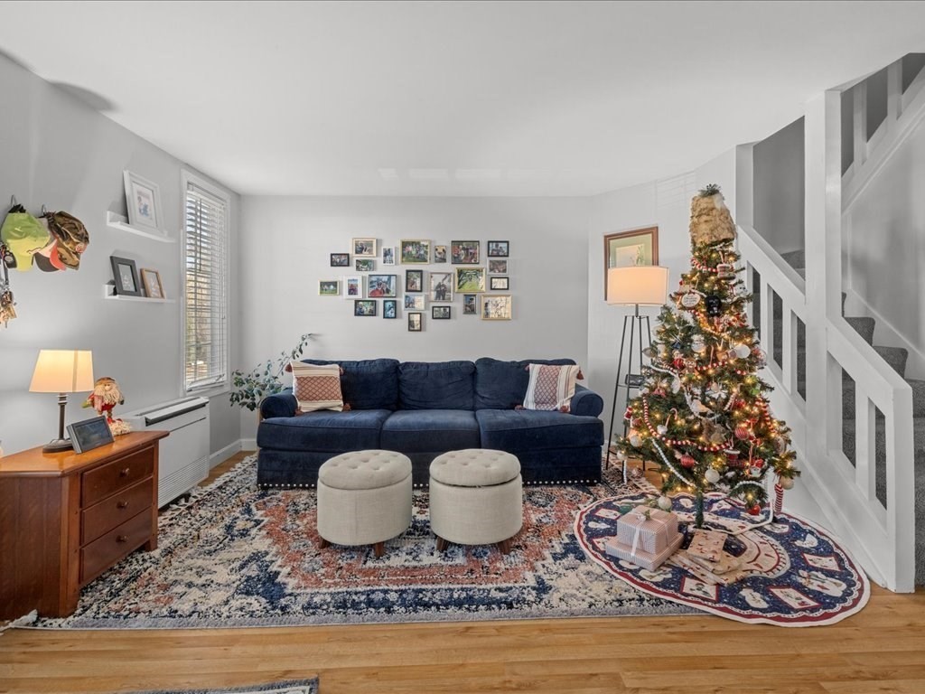4 Strathmore Shire Drive, Unit B Uxbridge, MA 01569 - Photo 9 of 41 a living room with furniture and a large window