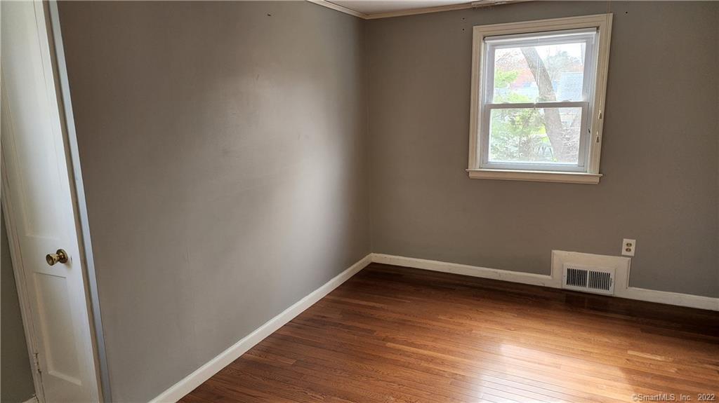 25 Madsen Road West Hartford, CT 06110 - Photo 12 of 16 a view of a room with wooden floor and windows