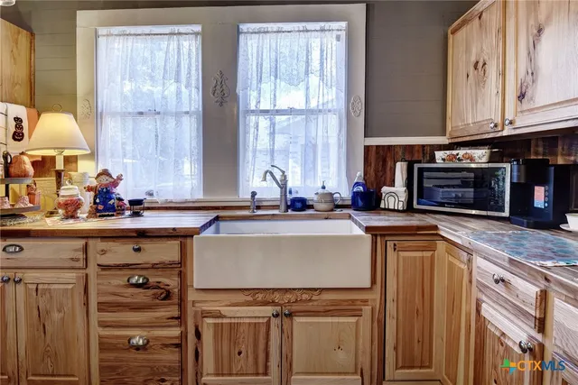 a bedroom with a bed and dresser