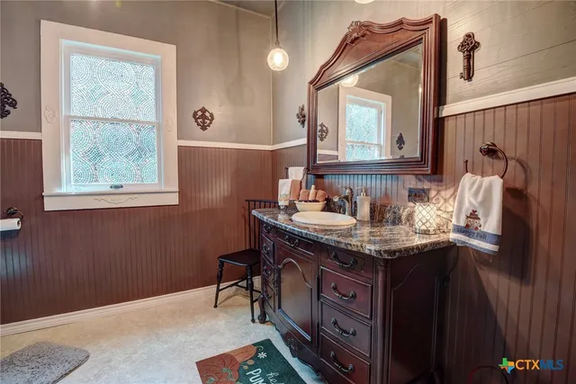 a bathroom with a shower and a mirror