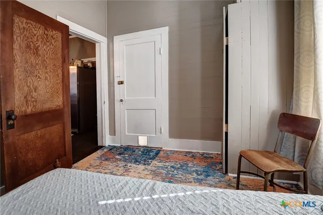 a white bath tub sitting next to a white sink
