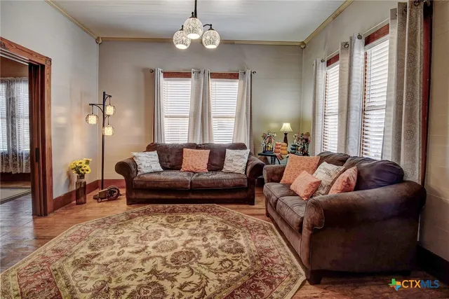 a living room with furniture and a window