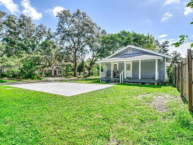 a view of house with a garden
