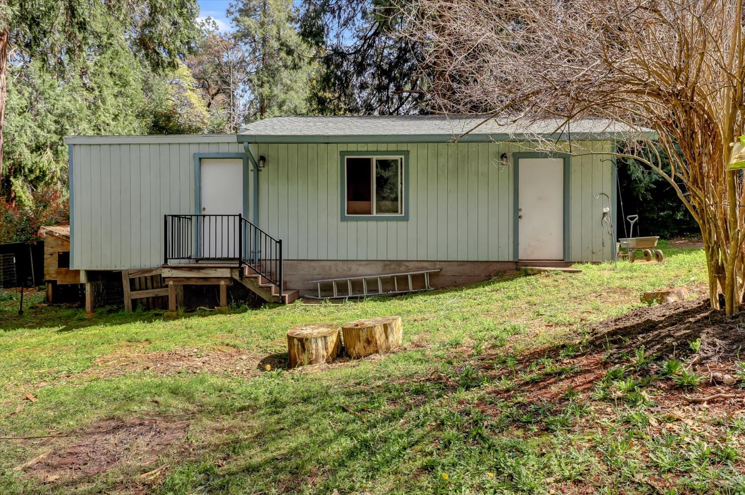 11312 Alpine Lane Grass Valley, CA 95945 - Photo 49 of 69 a backyard of a house with yard and barbeque oven