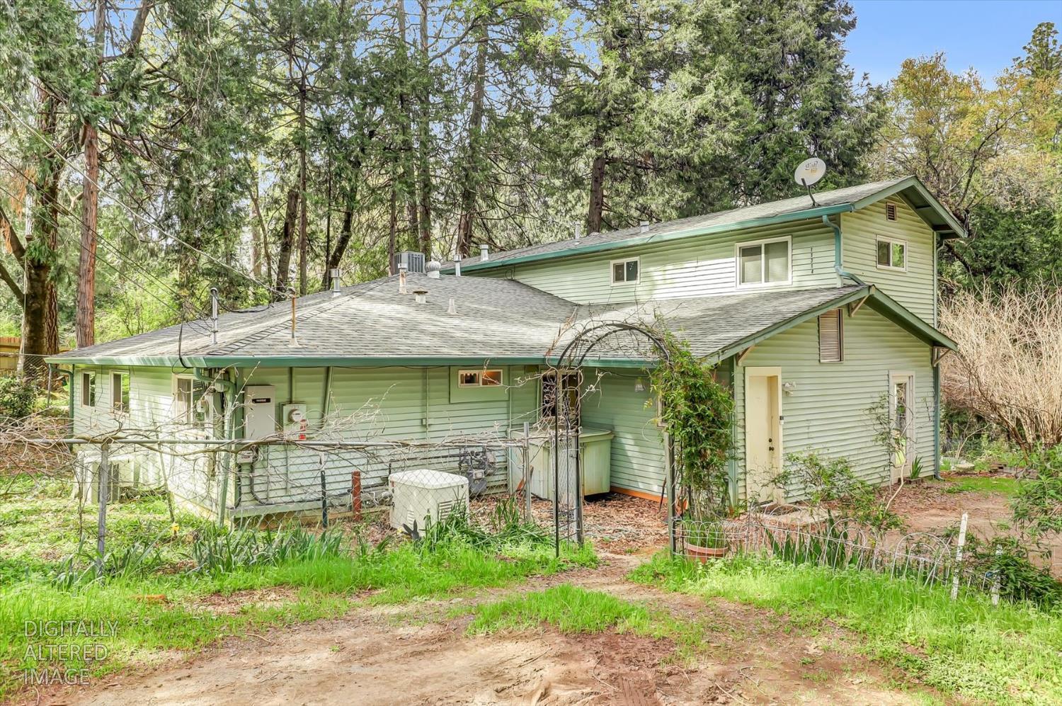 11312 Alpine Lane Grass Valley, CA 95945 - Photo 60 of 69 a view of a white house with a big yard and large trees