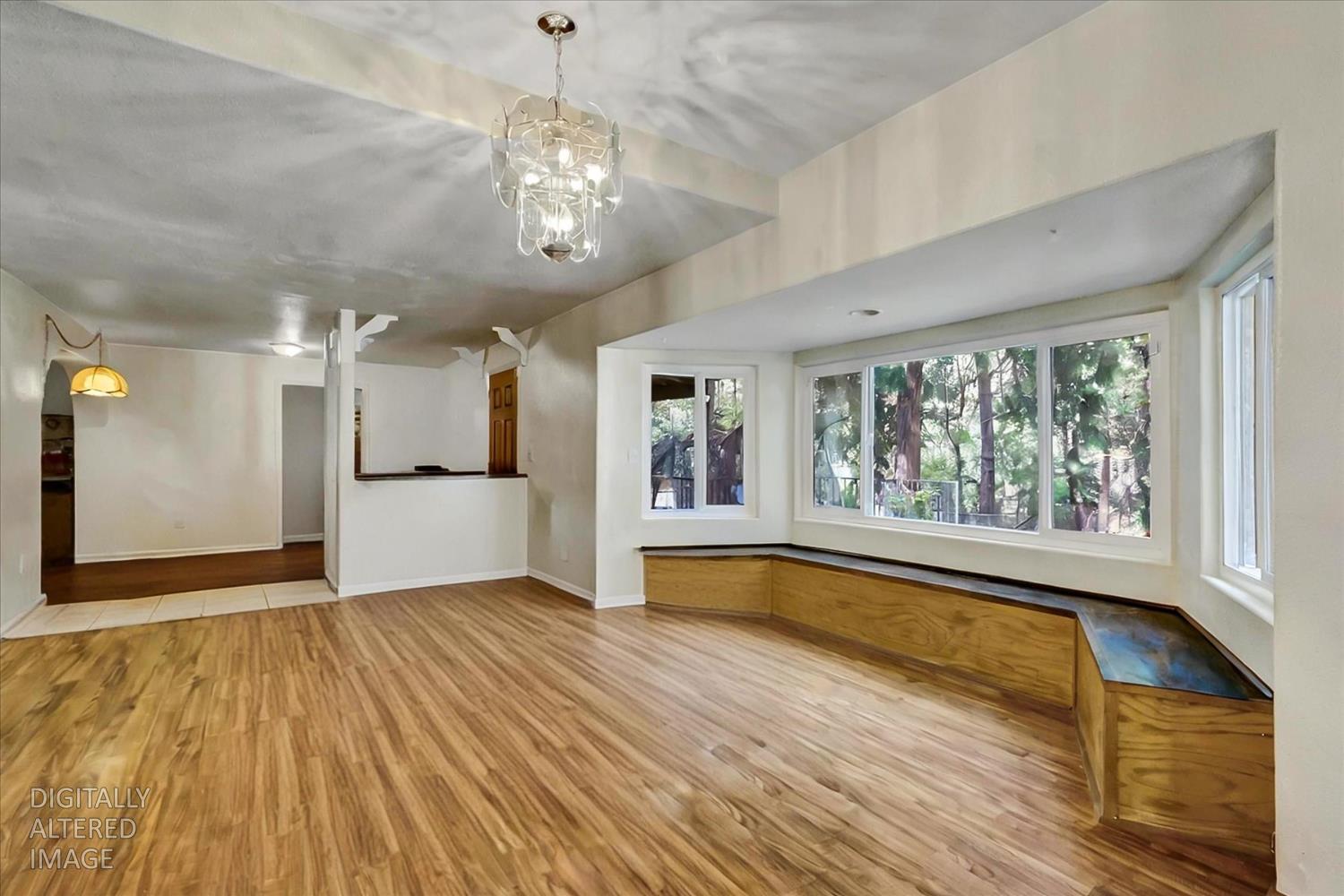 11312 Alpine Lane Grass Valley, CA 95945 - Photo 9 of 69 a view of empty room with wooden floor and fan