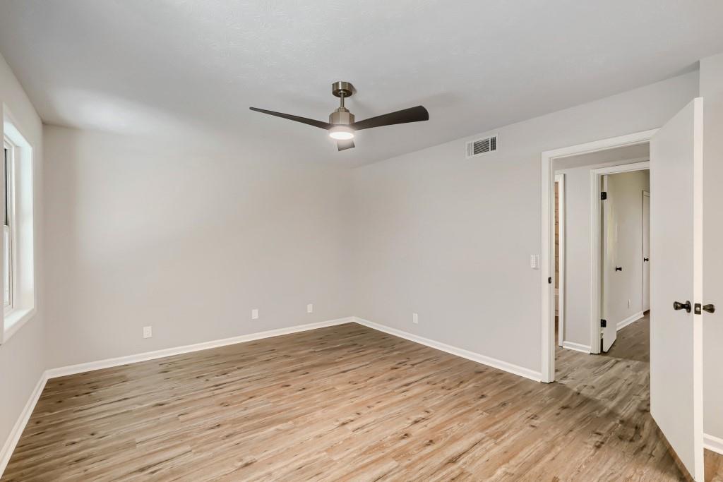 2021 Irwin Bridge Road Northwest Conyers, GA 30012 - Photo 28 of 43 wooden floor in an empty room