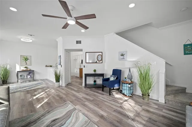 a bedroom with a bed and a potted plant