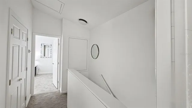 a view of a swimming pool with a patio and a yard