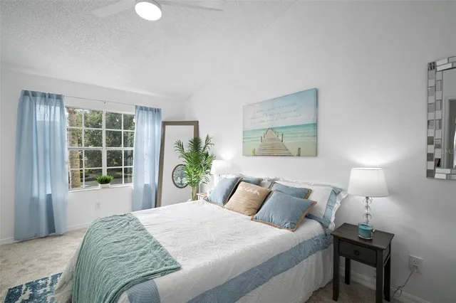 a view of a patio with table and chairs and potted plants