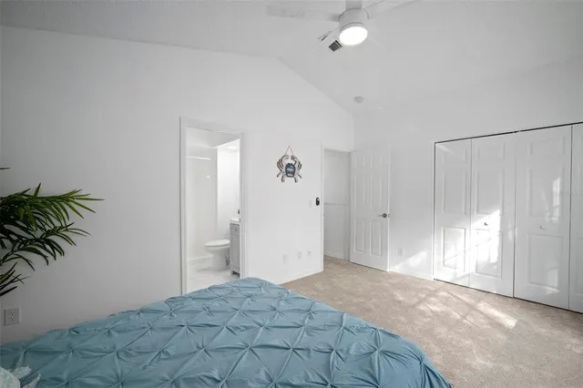 an aerial view of residential houses with outdoor space and trees