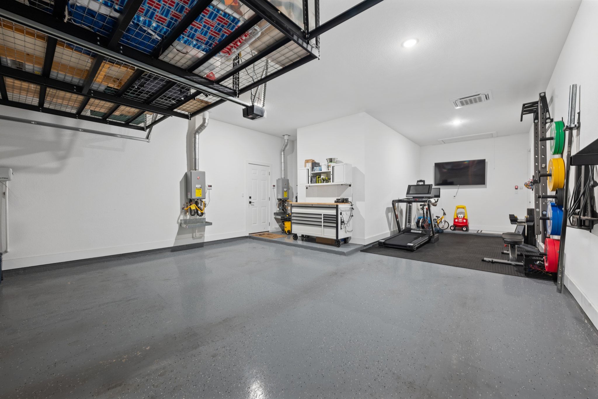 159 Short Bush Pass Austin, TX 78737 - Photo 32 of 39 Tandem garage with extra storage and mini split AC.