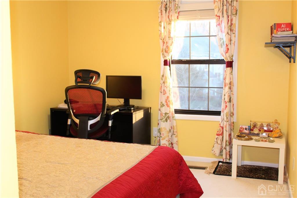4602 Stonehedge Road, Unit 4602 Edison, NJ 08820 - Photo 11 of 25 a bedroom with a bed and a window