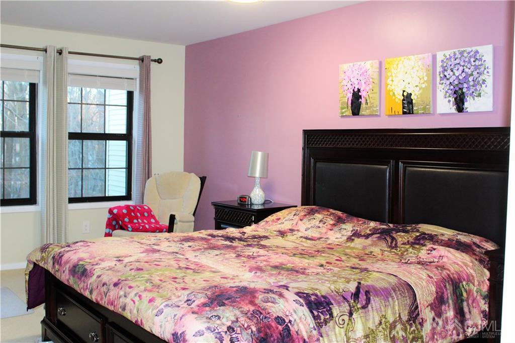 4602 Stonehedge Road, Unit 4602 Edison, NJ 08820 - Photo 17 of 25 a bedroom with a bed and a window