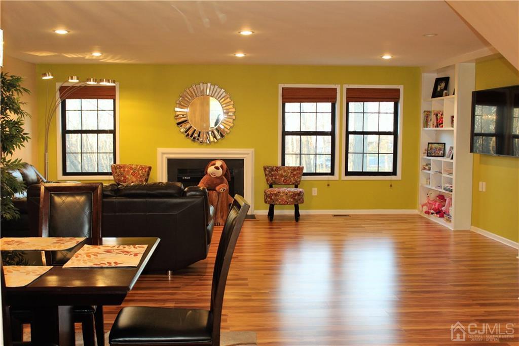 4602 Stonehedge Road, Unit 4602 Edison, NJ 08820 - Photo 3 of 25 a living room with furniture and a fireplace
