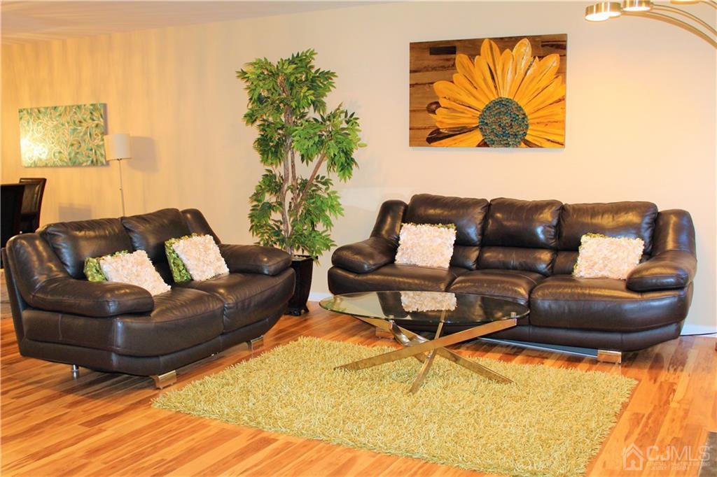 4602 Stonehedge Road, Unit 4602 Edison, NJ 08820 - Photo 4 of 25 a living room with furniture and a couch