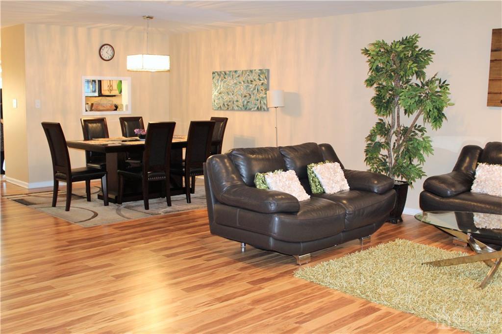 4602 Stonehedge Road, Unit 4602 Edison, NJ 08820 - Photo 6 of 25 a living room with furniture and wooden floor