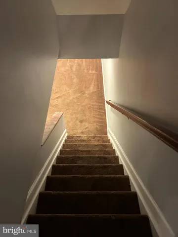 an empty room with wooden floor