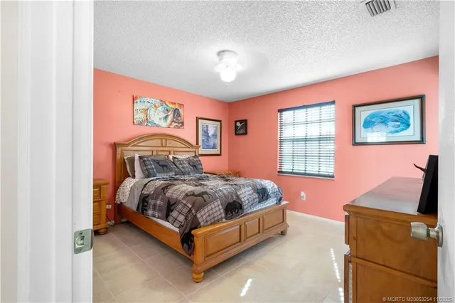 a bed room with a bed and a window