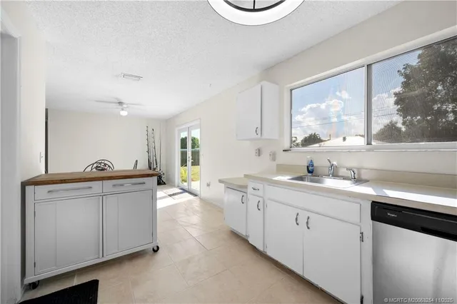 a kitchen with a stove and cabinets