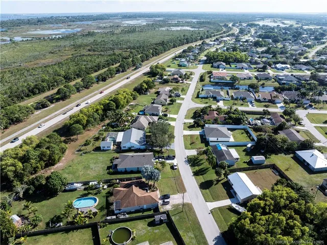 an aerial view of houses with outdoor space
